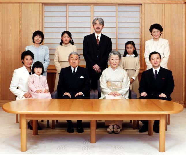 Emperor Akihito and empress Michiko pose for a photograph for the New Year with their family at the Imperial Palace, Dec. 14, 2004. Family members are Crown prince Naruhito (front R), crown princess Masako (L) holding their daughter Aiko, princess Sayako (back L), prince Akishino (back C) and his wife princess Kiko (back R) and their daughters Mako (back 2nd L) and Kako.