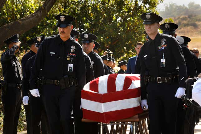 Los Angeles Police Department officers carry the Officer Houston R. Tipping’s casket at the beginning of his memorial service in June.