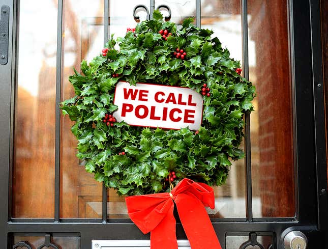 Image for article titled Landlord Positions ‘We Call Police’ Sign In Middle Of Christmas Wreath