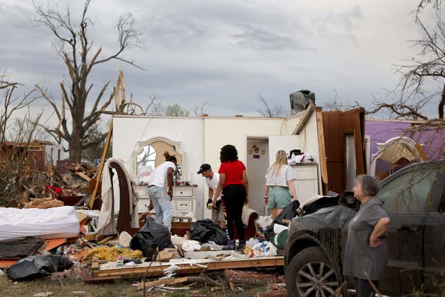 Residents continue to recover possessions and secure homes that were damaged by Friday’s tornado on March 26, 2023 in Rolling Fork, Mississippi.