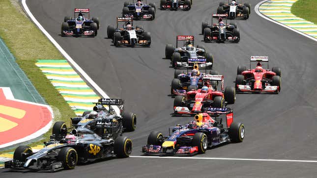 A photo of the 2014 Formula 1 grid racing in Brazil. 