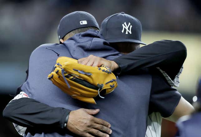 Sabathia embraces Dellin Betances after being removed from his last regular-season home start.