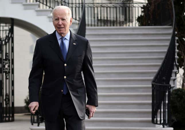  U.S. President Joe Biden walks toward members of the press before a Marine One departure from the White House on March 23, 2022, in Washington, DC.