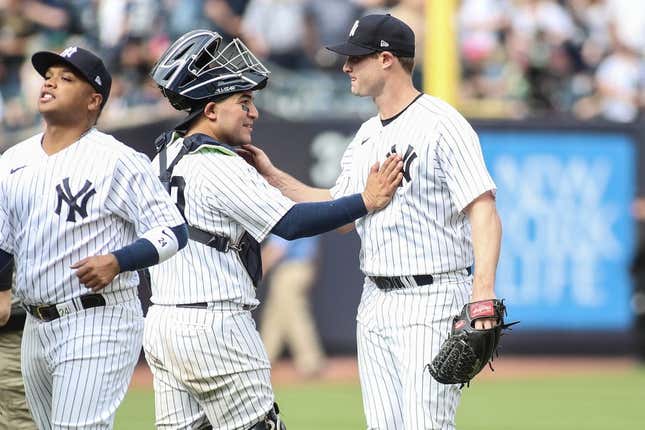 Apr 16, 2023; Bronx, New York, USA;  New York Yankees starting pitcher Gerrit Cole (45) celebrates with catcher Jose Trevino (39) after pitching a complete game shutout to beat the Minnesota Twins 2-0 at Yankee Stadium.