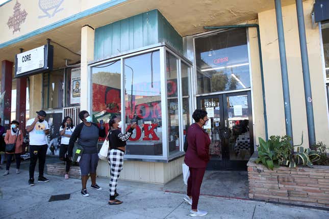 People wait in line to enter at Eso Wan on November 28, 2020 in Los Angeles. The bookstore is Black-owned, and at the height of that summer’s protests against police brutality, saw a huge spike in sales.