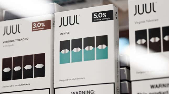 A row of Juul vapes with menthol and tobacco flavors.