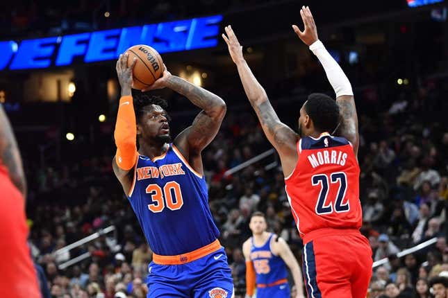 Feb 24, 2023; Washington, District of Columbia, USA; New York Knicks forward Julius Randle (30) shoots over Washington Wizards guard Monte Morris (22) during the first half at Capital One Arena.
