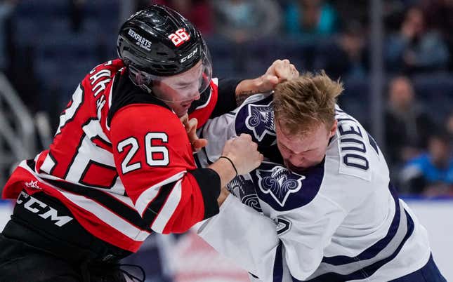 Nathan Ouellet of the Rimouski Oceanic and Thomas Caron of the Quebec Remparts fight during their QMJHL hockey game.