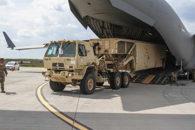 THAAD missile launcher being loaded on a U.S. Air Force C-17 transport.