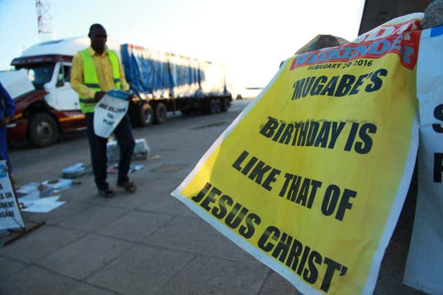 A banner compares Mugabe’s birthday to the birth of Jesus Christ in Harare, Feb. 21.