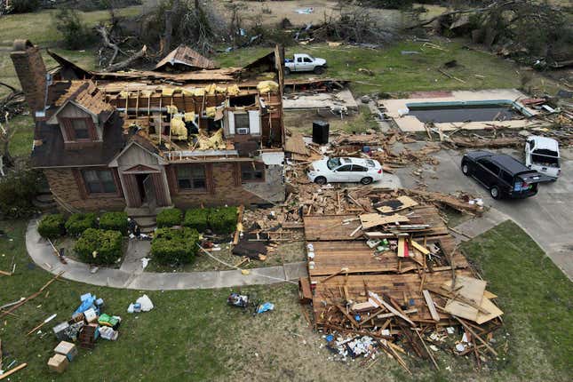 Debris is strewn about a tornado damaged home, Sunday, March 26, 2023, in Rolling Fork, Mississippi.