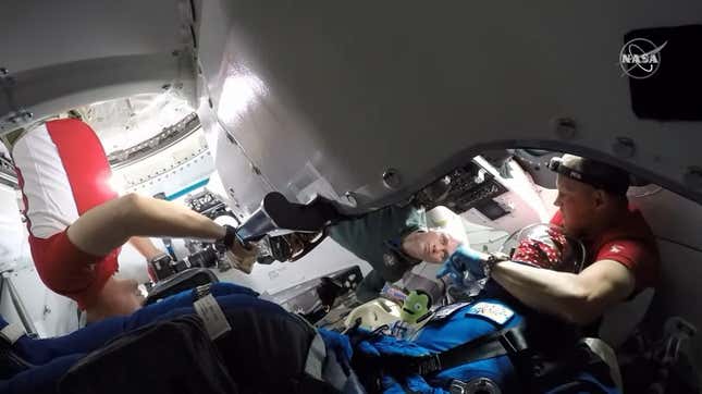 Astronauts enter the Starliner and greet a test dummy who took the flight up.
