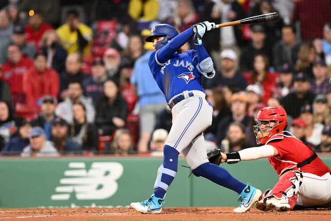 May 1, 2023; Boston, Massachusetts, USA; Toronto Blue Jays shortstop Bo Bichette (11) hits a three-run home run against the Boston Red Sox during the second inning at Fenway Park.