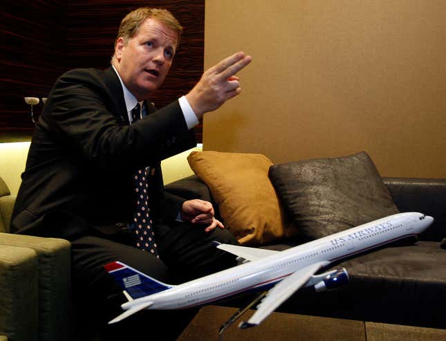 US Airways chief executive Doug Parker speaks during a news conference at Ben Gurion International airport near Tel Aviv July 8, 2009. US Airways has no plans to reduce its capacity any further even as the recession has dampened demand, particularly for business travel, Parker said on Wednesday.