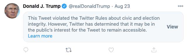 A tweet from Donald Trump is obscured by a warning label, which tells users the tweet violates Twitter's rules but gives them the option to see it anyway.