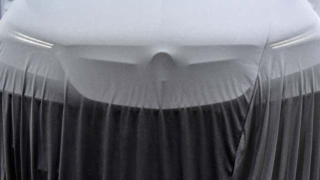 A photo of a car under a cover