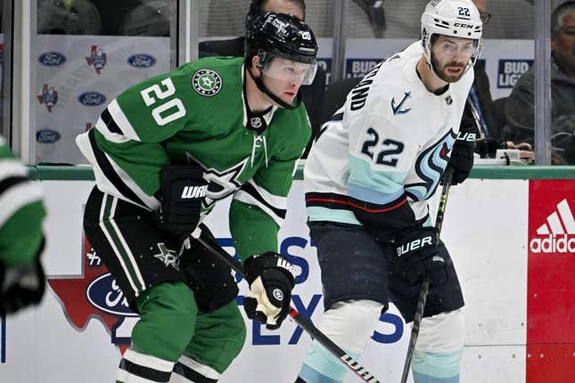 Mar 21, 2023; Dallas, Texas, USA; Dallas Stars defenseman Ryan Suter (20) and Seattle Kraken right wing Oliver Bjorkstrand (22) in action during the game between the Dallas Stars and the Seattle Kraken at the American Airlines Center.