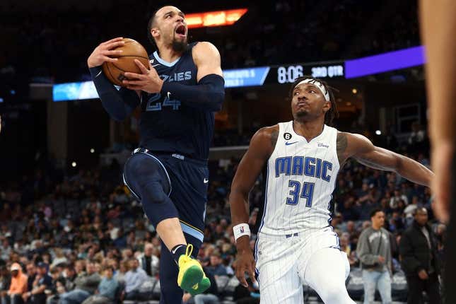 Mar 28, 2023; Memphis, Tennessee, USA; Memphis Grizzlies forward Dillon Brooks (24) drives to the basket as Orlando Magic center Wendell Carter Jr. (34) defends during the second half at FedExForum.