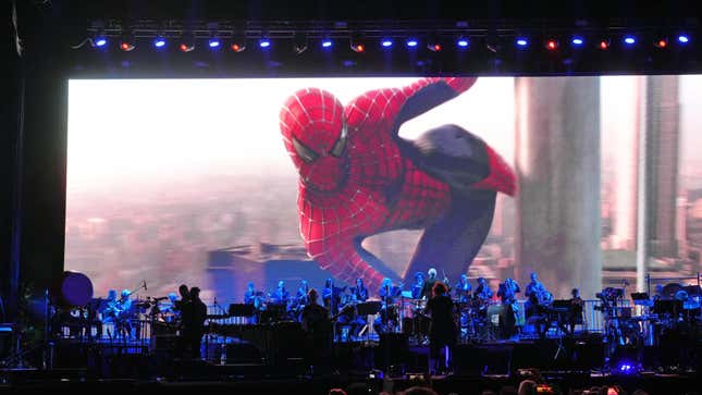 A screen showing Spider-Man behind Danny Elfman's band at Coachella.