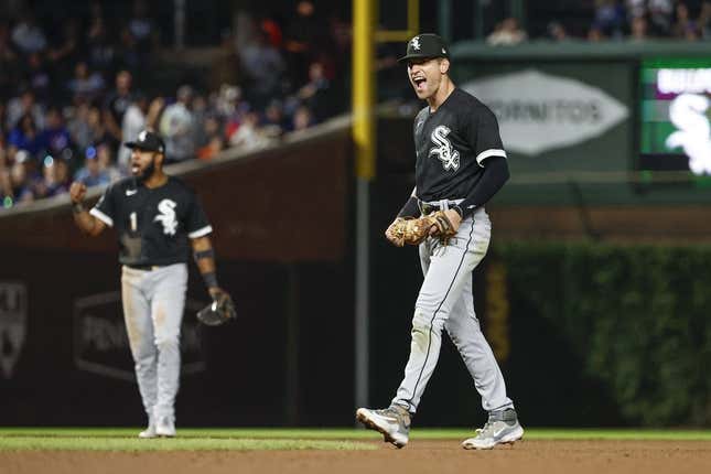 Aug 15, 2023; Chicago, Illinois, USA; Chicago White Sox second baseman Zach Remillard (28) celebrates after tagging out Chicago Cubs second baseman Nico Hoerner at second base during the seventh inning at Wrigley Field.