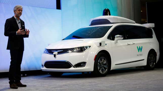 Former CEO of Waymo John Krafcik debuts a customized Chrysler Pacifica Hybrid during the 2017 North American International Auto Show.