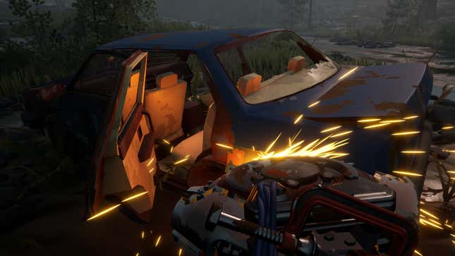 A cutting tool is used to scrap a broken down car.