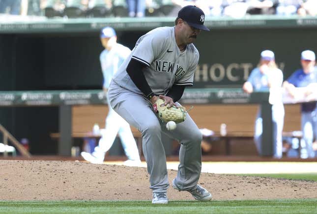 Apr 30, 2023; Arlington, Texas, USA;  New York Yankees relief pitcher Nick Ramirez (63) bobbles the ball during the eighth inning against the Texas Rangers at Globe Life Field.
