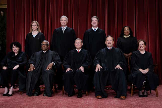 Members of the Supreme Court sit for a new group portrait following the addition of Associate Justice Ketanji Brown Jackson, at the Supreme Court building in Washington, Oct. 7, 2022. 