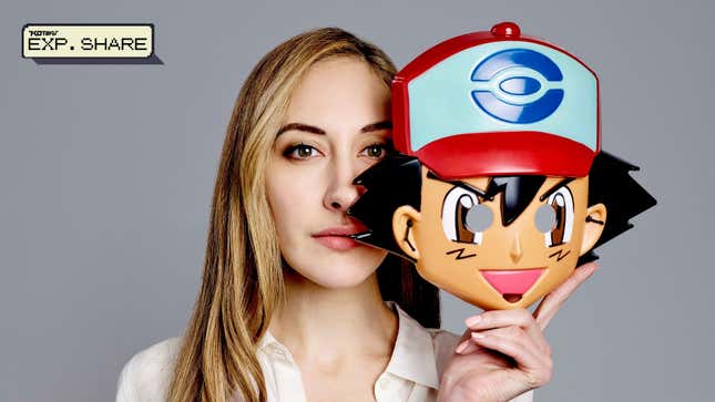 Sarah Natochenny is seen holding a Halloween mask of Ash Ketchum. The Exp. Share logo is in the top left corner.