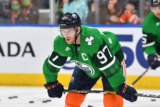 Connor McDavid warms up wearing a St. Patricks Day-themed jersey on March 17, 2022, at Rogers Place in Edmonton, Alberta, Canada
