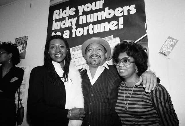 Curtis Sharp Jr., center, joins his wife, Barbara, right and girlfriend Jacqueline Bernabela at the World Trade Center Tuesday December 1, 1982 to celebrate his winning the New York State Lotto jackpot of $5 million. The 44-year-old Sharp, from Newark, N.J., said he and Barbara were “going to get a divorce, but she seems not to sure now.” He introduced Miss Bernabela as his “wife-to-be.” 