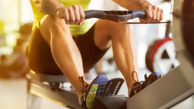 Person using a rowing machine in a gym