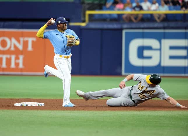 Apr 8, 2023; St. Petersburg, Florida, USA; Tampa Bay Rays shortstop Wander Franco (5) forces out Oakland Athletics left fielder Seth Brown (15) during the fifth inning at Tropicana Field.