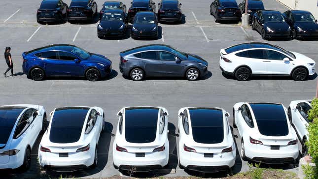 Brand new Tesla cars sit in a parking lot at a Tesla showroom on June 27, 2022 in Corte Madera, California. 
