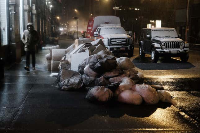 People walk along a street during a storm on February 27, 2023 in New York City.