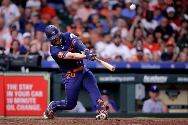 Jul 24, 2023; Houston, Texas, USA; Houston Astros left fielder Chas McCormick (20) hits a sacrifice fly for an out against the Texas Rangers during the fifth inning Minute Maid Park.