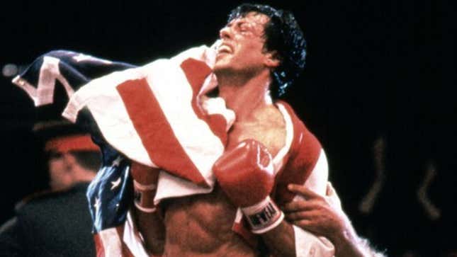 A screenshot of Rocky draped in the American flag, from Rocky IV