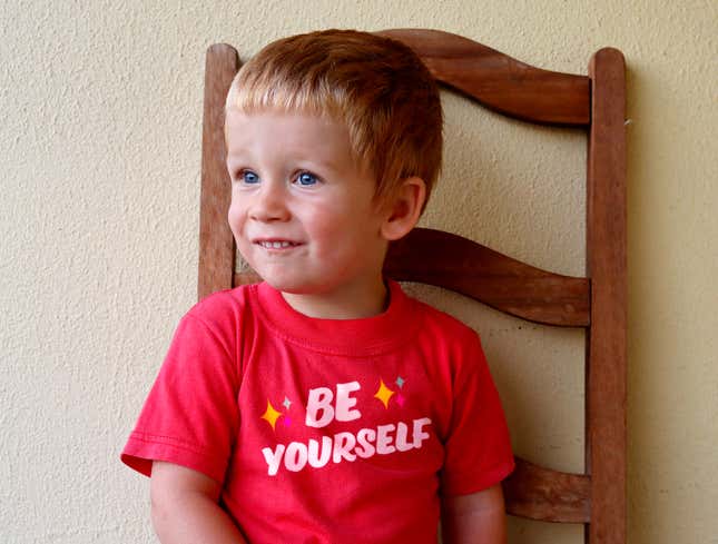 Image for article titled Child Not Quite Confident Enough To Pull Off ‘Be Yourself’ Shirt