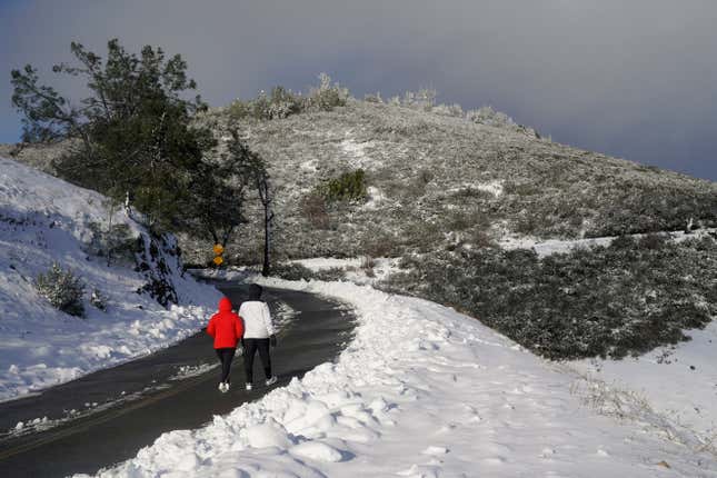 People walk up Summit Road while visiting Mount Diablo State Park in Walnut Creek, California, Monday, Feb. 27, 2023