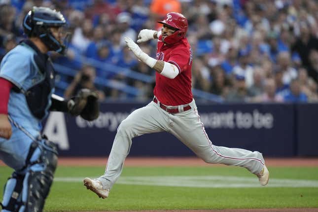 Aug 16, 2023; Toronto, Ontario, CAN; Philadelphia Phillies right fielder Nick Castellanos (8) scores against the Toronto Blue Jays on a sacrifice fly by Philadelphia Phillies left fielder Jake Cave (not pictured) during the second inning at Rogers Centre.