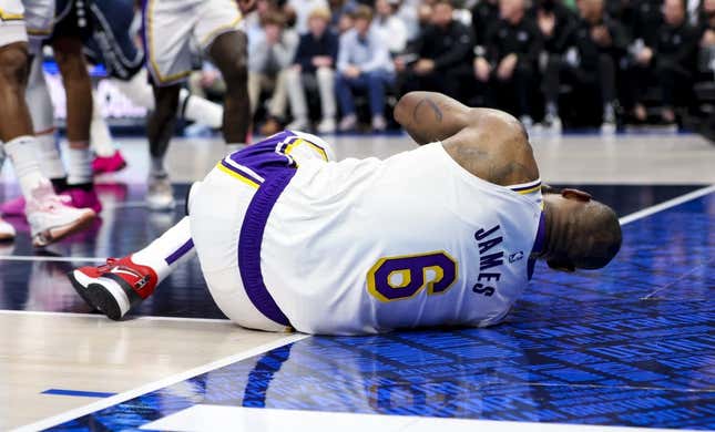 Feb 26, 2023; Dallas, Texas, USA; Los Angeles Lakers forward LeBron James (6) lays on the floor injured during the second half against the Dallas Mavericks at American Airlines Center.