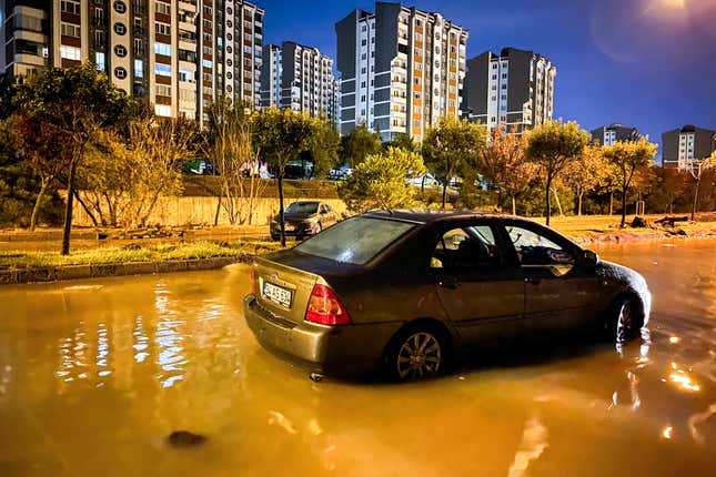 Vehicles are scattered during floods after heavy rains in Istanbul, Turkey, early Wednesday, Sept. 6, 2023. Fierce rainstorms battered neighboring Greece, Turkey and Bulgaria on Tuesday, triggering flooding that caused at least seven deaths, including two holidaymakers swept away by a torrent that raged through a campsite in northwestern Turkey. (Sercan Ozkurnazli/Dia Images via AP)