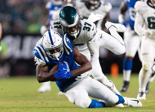Aug 24, 2023; Philadelphia, Pennsylvania, USA; Philadelphia Eagles cornerback Kelee Ringo (37) tackles Indianapolis Colts wide receiver Breshad Perriman (9) after his catch during the third quarter at Lincoln Financial Field.