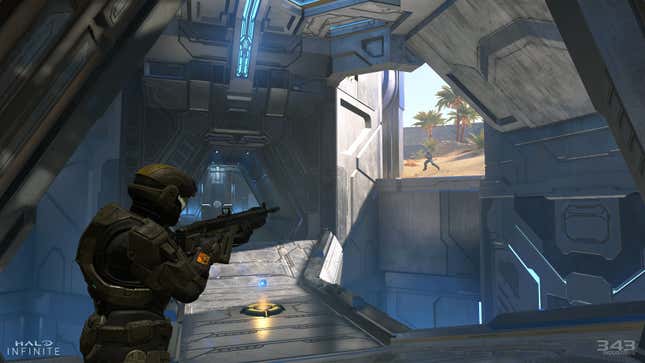 A Halo character aims at another spartan in multiplayer while aiming at another spartan in the distance.
