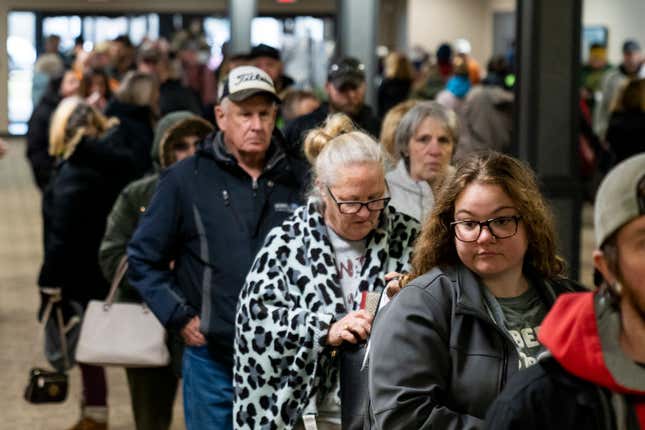 People wait in line at the Norfolk Southern Assistance Center to collect a $1,000 check and get reimbursed for expenses while they were evacuated. 