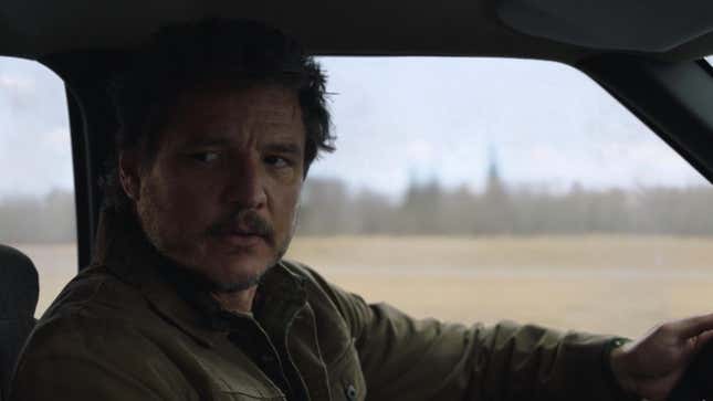 Pedro Pascal as Joel looks intently toward the passenger seat of the truck he's driving in HBO's The Last of Us.