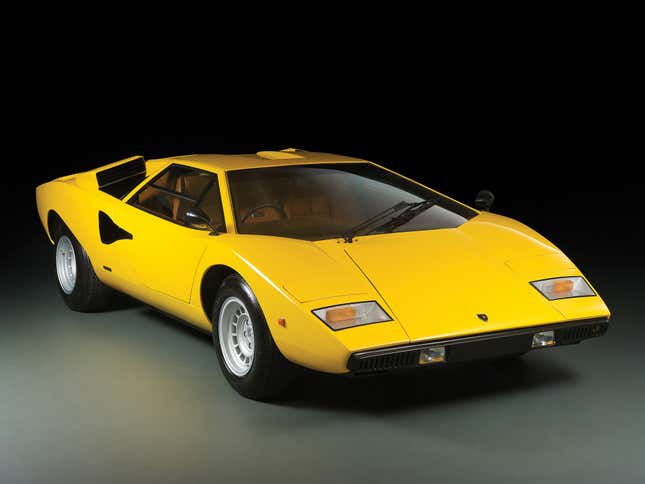 Lamborghini press image of a yellow Countach LP400, viewed from the front quarter.