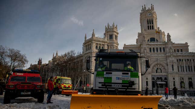 A truck-mounted snowblower works at Plaza de Cibeles a day after the heaviest snowfall in decades on January 10, 2021 in Madrid, Spain. 