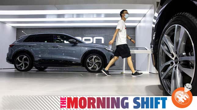 A man walks through the Audi display at the 2022 Central China International Auto Show.