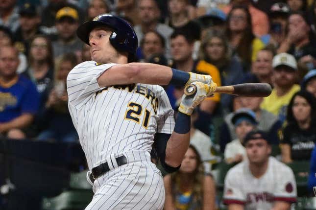 Sep 16, 2023; Milwaukee, Wisconsin, USA; Milwaukee Brewers left fielder Mark Canha (21) drives in a run with a base hit against the Washington Nationals in the first inning at American Family Field.
